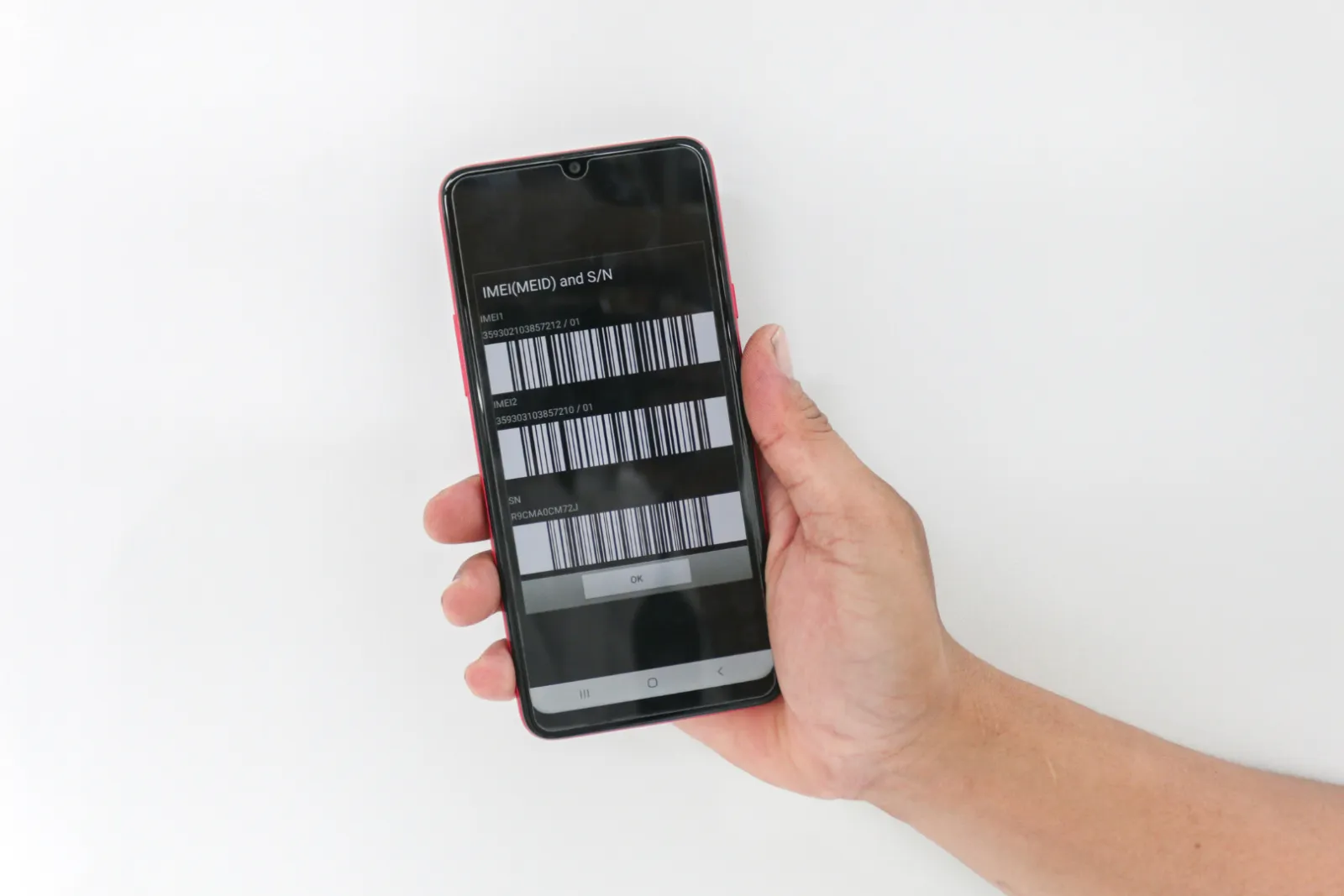 IMEI番号が表示されている携帯電話